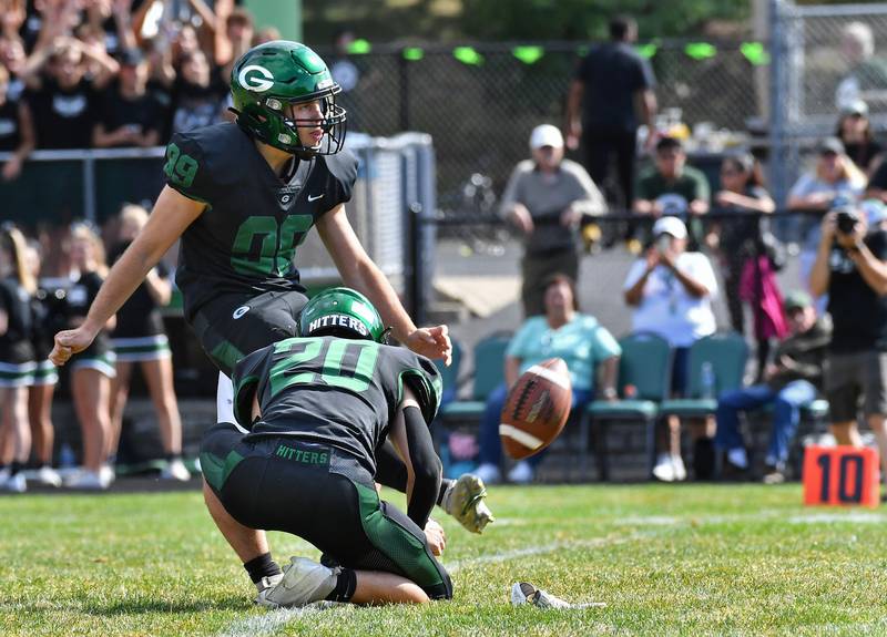 Glenbard West's Aidan Nelson (99) kicks the game winning extra point late in a game against Marist on Aug. 26, 2023 at Glenbard West High School in Glen Ellyn.