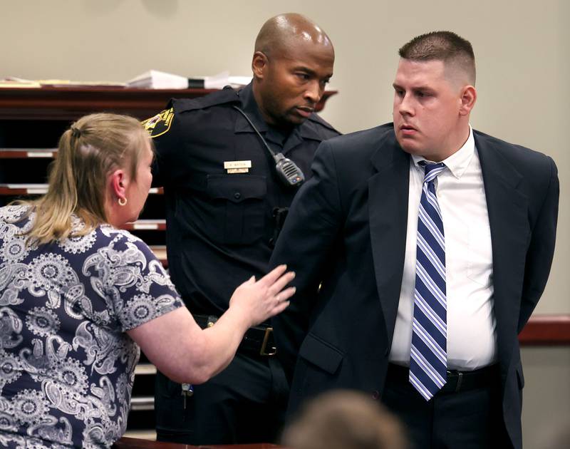 Former police officer James Corralejo (right) talks to his mom Wendy Corralejo as he is taken into custody Thursday, July 17, 2025, at the DeKalb County Courthouse in Sycamore. James Corralejo was sentenced to four years in prison for a Class 2 felony count of driving under the influence of alcohol causing death for a 2023 crash that killed DeKalb woman Graciela Reza Contreras.