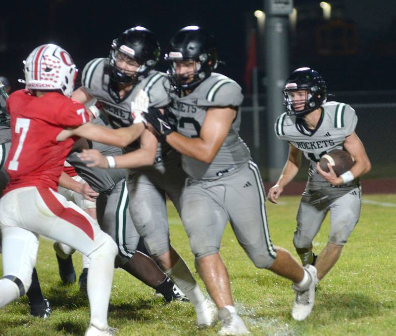 Rock Falls' Logan Thome looks for a hole in the line against Oregon on Friday, Sept. 19, 2025 at Landers-Loomis Field in Oregon.