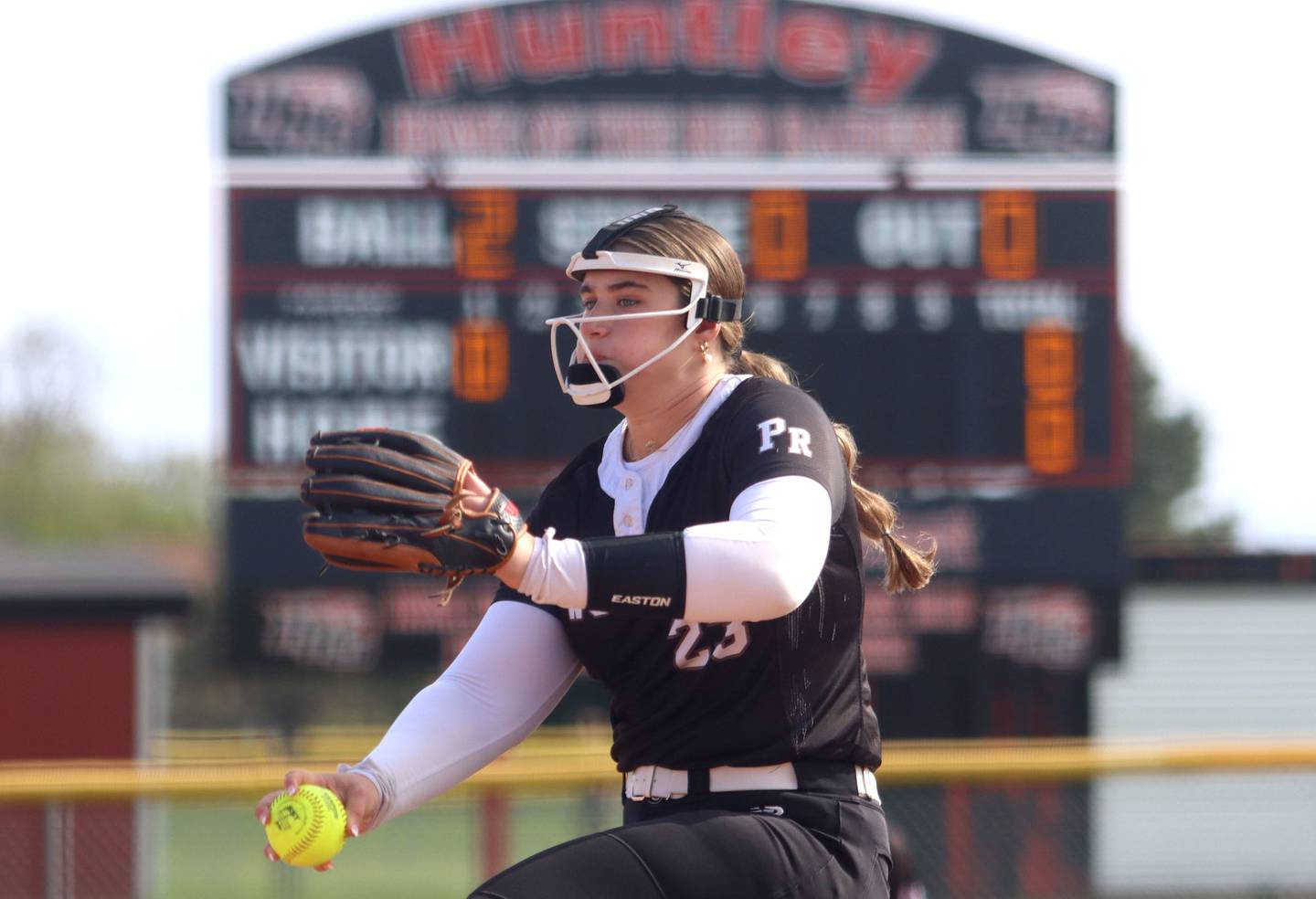 Prairie Ridge’s Reese Mosolino delivers in varsity softball at Huntley High School in Huntley on Monday, May 5, 2025.