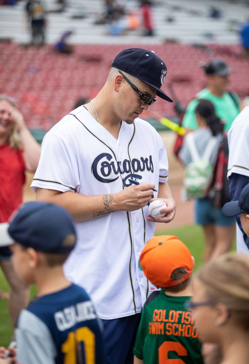 Pitcher Vance Worley signs autographs after the Kane County Cougar's Youth Clinic at Northwestern Medicine Field on Saturday, July 16, 2022.