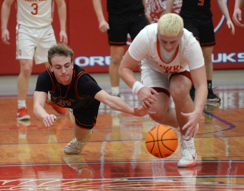 Erie-Prophetstown's Keegan Winckler (eft) and Oregon's Kade Girton dive after a loose ball on Monday, Feb. 24, 2025 in 2A regional action at the Blackhawk Center in Oregon.