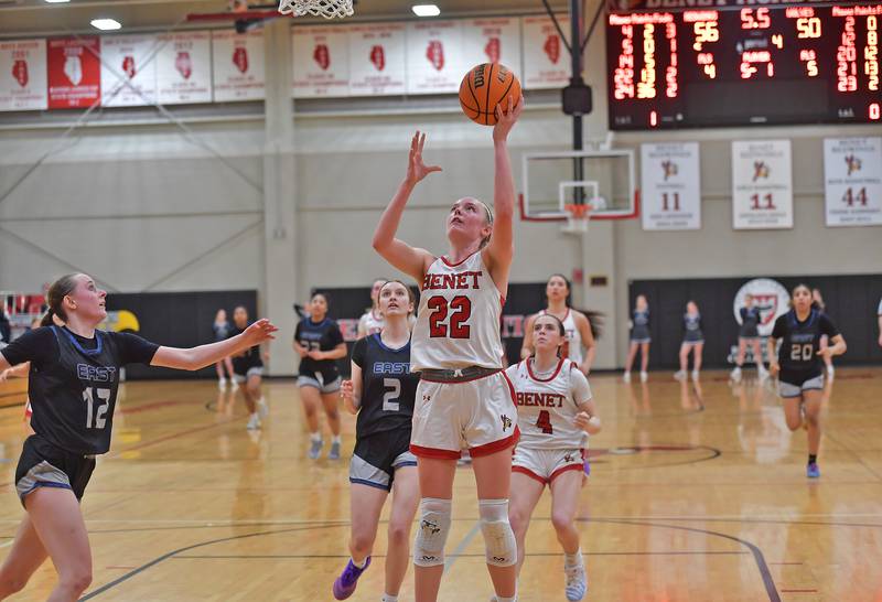 Benet’s Bridget Rifenburg (22) puts up the final basket of the game to seal the win over Oswego East in the Class 4A Benet Regional final on February 19, 2026 at Benet Academy in Lisle.
