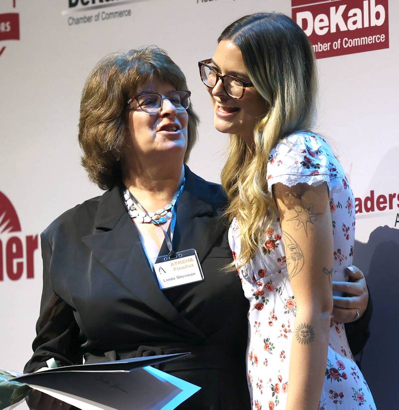 Linda Sherman, (left) an Athena Award finalist, talks to her daughter Katie Sherman who introduced her and talked about why she is deserving of her nomination Thursday, Oct. 16, 2025, during the 35th annual Athena and Women of Accomplishment Award Reception at the Egyptian Theatre in DeKalb.