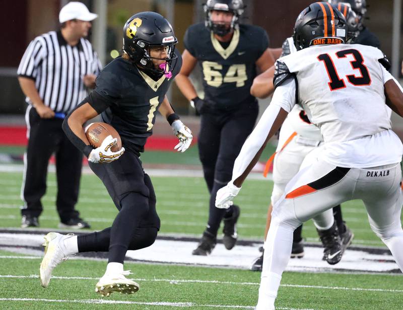 Sycamore's Josiah Mitchell looks to get by DeKalb's Davon Grant Friday, Aug. 29, 2025, during the FNBO Challenge in Huskie Stadium at Northern Illinois University.