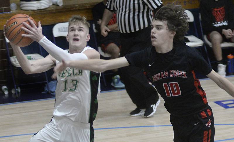 Indian Creek’s Logan Schrader works to stop Seneca’s Paxton Giertz from shooting in the first quarter of Monday's game at the Marquette Christmas Tournament at Bader Gym in Ottawa. - 12/26/22