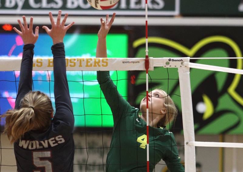 Crystal Lake South’s Bella Toniolo, right, and  Prairie Ridge’s Grace Jansen battle at the net in varsity volleyball at Crystal Lake South Tuesday night.