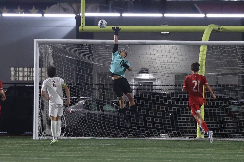 Lockport’s Matas Odinas leaps to block a shot against Hinsdale Central in the Class 3A Morton Supersectional on Tuesday, Nov. 5, 2024 in Cicero.