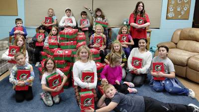 Sandwich church program members fill Christmas boxes