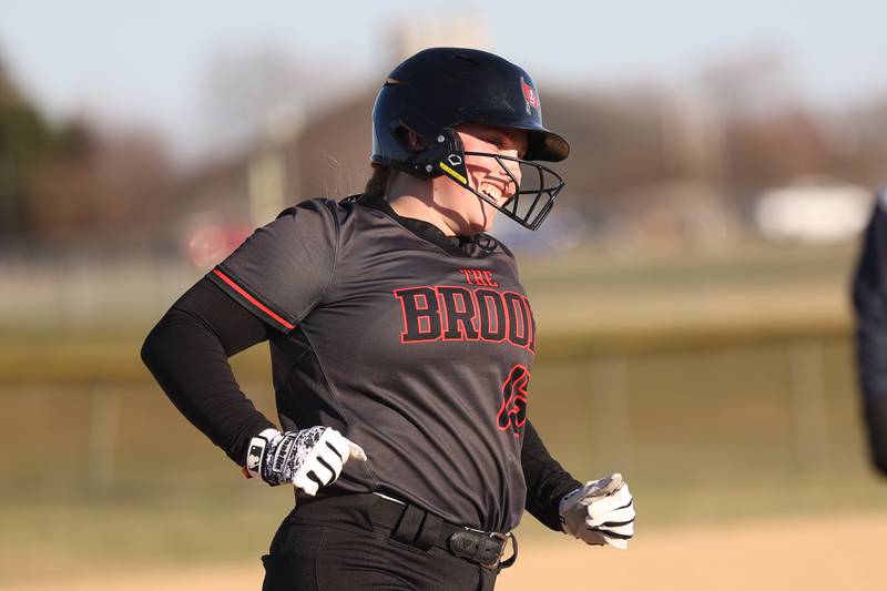 Bolingbrook’s Mackenzie McGrath smiles as she heads to third on a solo home run against Plainfield Central on Wednesday, March 20, 2024.