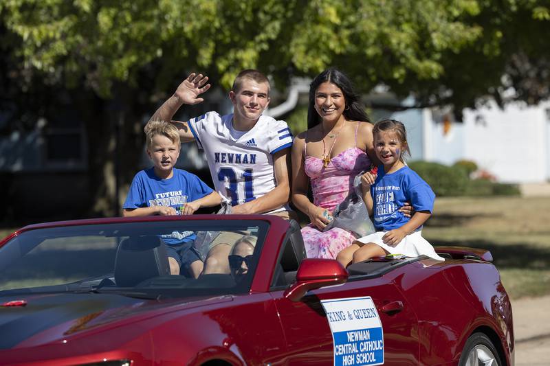 King and Queen Cody McBride and Mia Trujillo ride through the Newman High School homecoming parade Friday, Sept. 20, 2024, in Sterling.