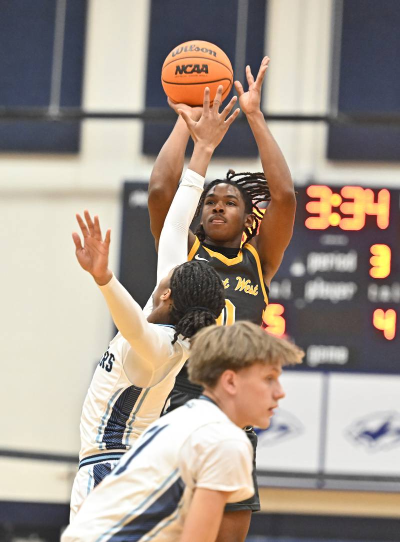 Joliet West's Aamir Shannon shoots a jump shot during the conference game against Plainfield South on Friday, DEC. 05, 2025, at Plainfield.