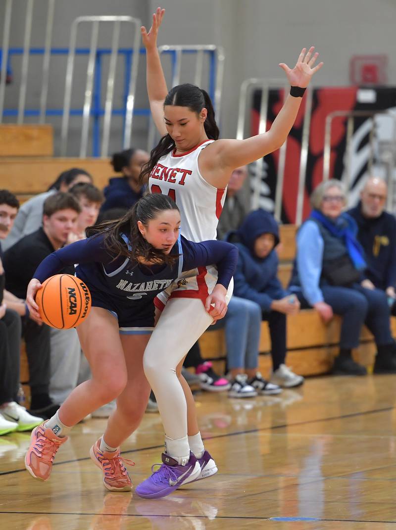 Nazareth’s Samantha Austin (2) drives around Benet’s Emma Briggs during a game on January 28, 2026 at Benet Academy in Lisle.