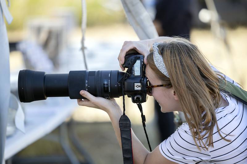 Anna Klimczak of Brookfield zooms in close for a picture of a bird Saturday, Sept. 21, 2024, at Nachusa Grassland’s Autumn on the Prairie.