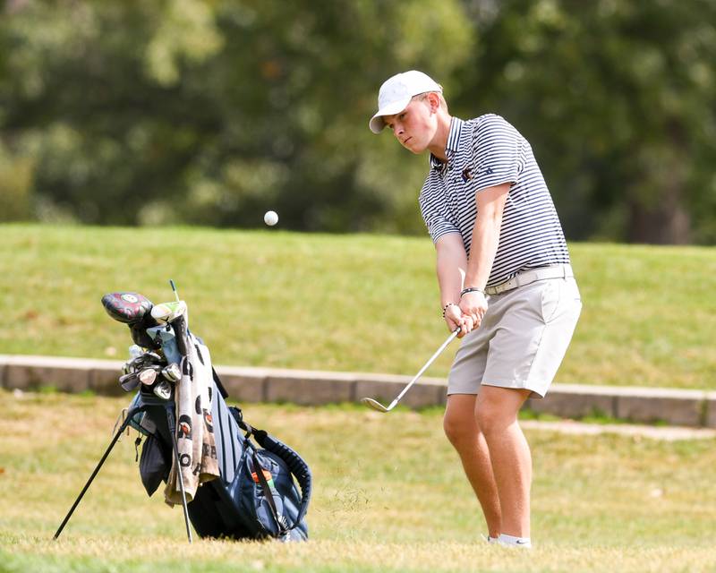 Jax Baker of Oswego watches his chip shot onto the green during the Plainfield Central regional on Wednesday Oct. 1, 2025, held at Wedgewood Golf Course in Plainfield.