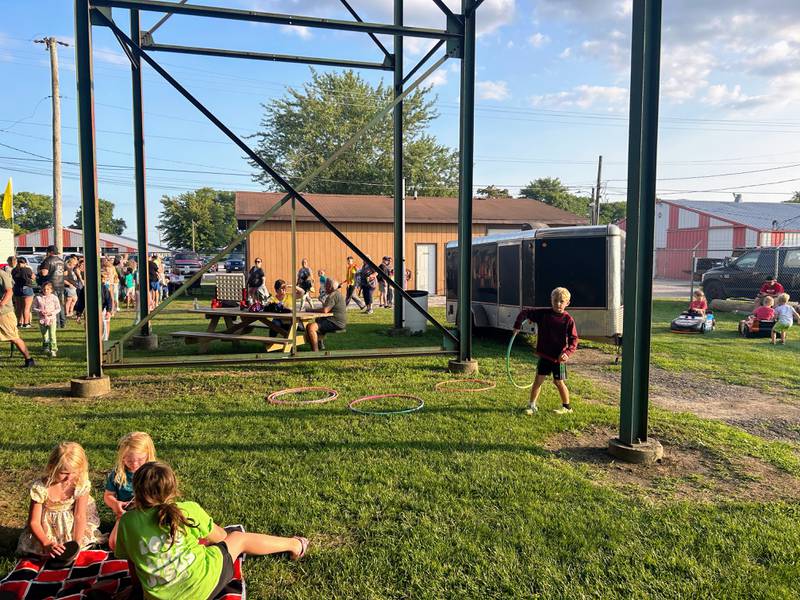 Kids play games, get their face painted and drive around in power wheels underneath the grandstand at Kids Night at the Grundy County Speedway.