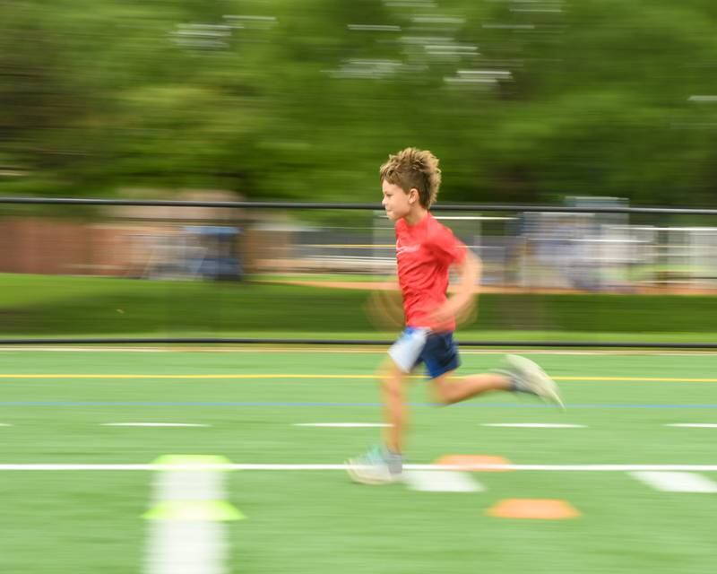 Brayden Quigg, 7, of Downers Grove runs the 40 yard dash during the NFL Youth Flag Football Combine Day held at Doerhoefer Park in Downers Grove on Sunday Aug. 6, 2023.