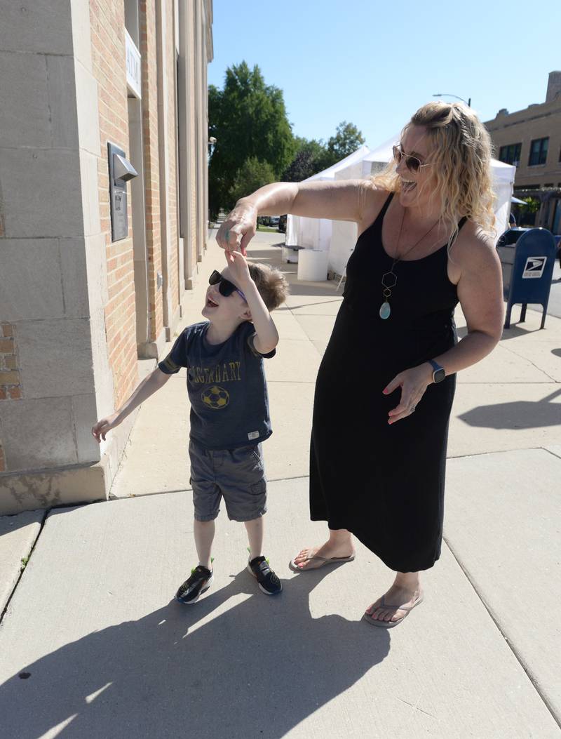 Thomas Myers and his mother Jennifer dance to the sounds of Badass Gumbo while attending the LaGrange Art Festival Saturday, Sept. 9, 2023.