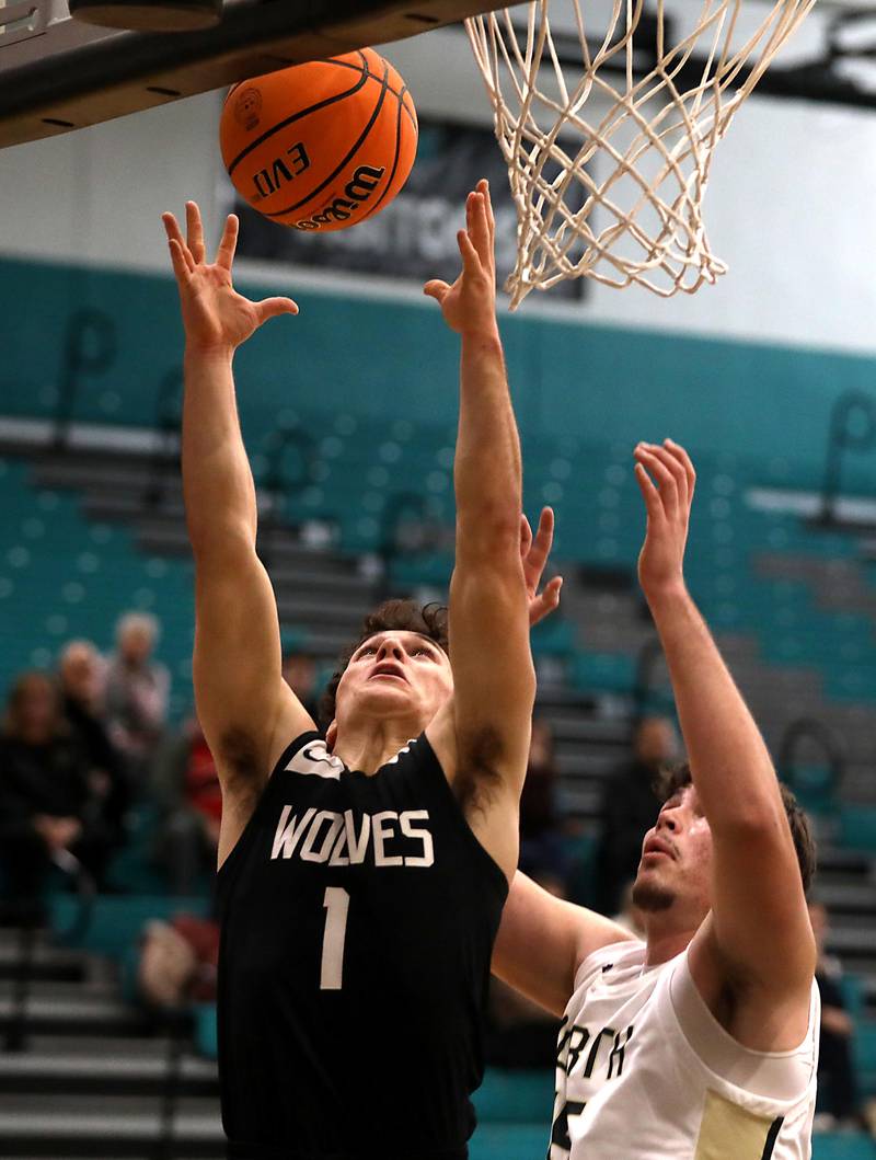 Prairie Ridge's Luke Vanderwiel grabs a rebound in front of Grayslake North's Uros Mitrovic during the 2025 Hoops for Healing tournament basketball game on Wednesday, Nov. 26, 2025, at Woodstock North High School.