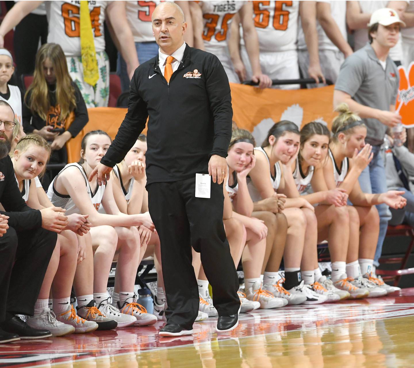 Byron coach Eric Yerly and his starters watch the final seconds of their team's loss to Breese Mater Dei at the 2A championship at Redbird Arena in Normal on Saturday, March 4. Breese won the game 62-46.