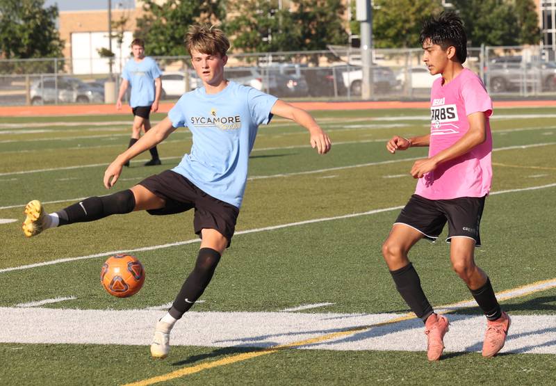 A Sycamore player controls the ball in front of a DeKalb player Monday, July 14, 2025, during a summer boys soccer friendly at DeKalb High School.