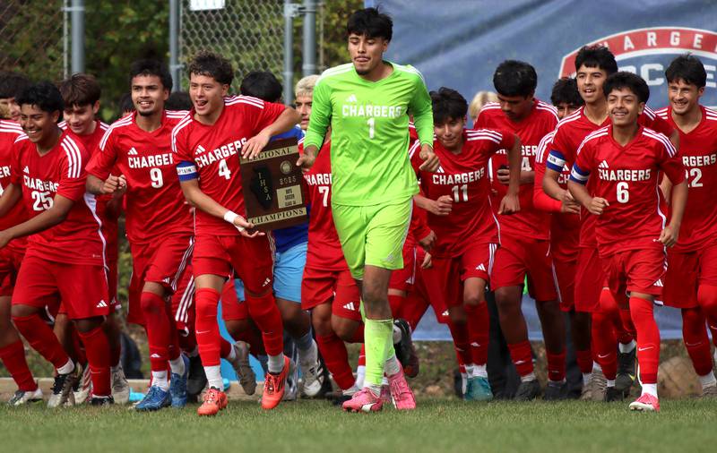 Dundee-Crown’s Chargers celebrate a 4-2 win over St. Charles East in IHSA Class 3A Regional Championship soccer at Dundee-Crown High School in Carpentersville on Saturday, October 25, 2025.
