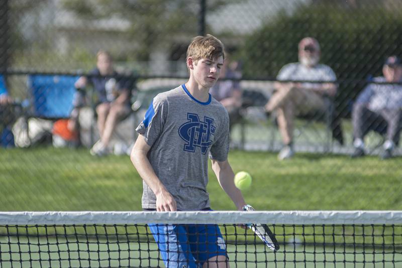 Newman’s Griffin Moran works the net against Sterling Monday, May 9, 2022. Moran and doubles partner James Rhodes faced off against Sterling’s Kayden Loos and Ben Boze.