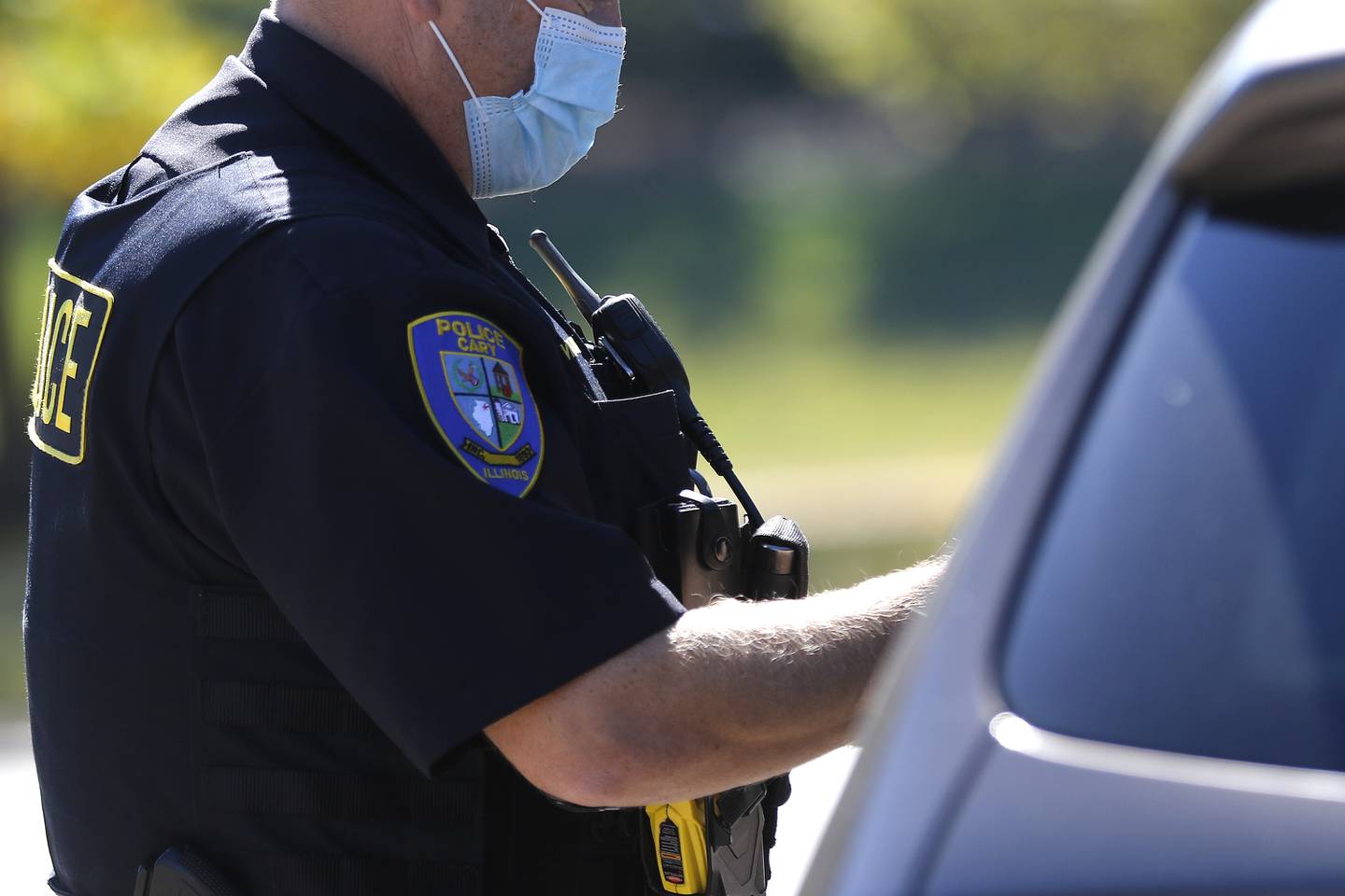 An unidentified police officer makes a traffic stop while wearing a facemask on Tuesday, Sept. 28, 2021 in Cary.