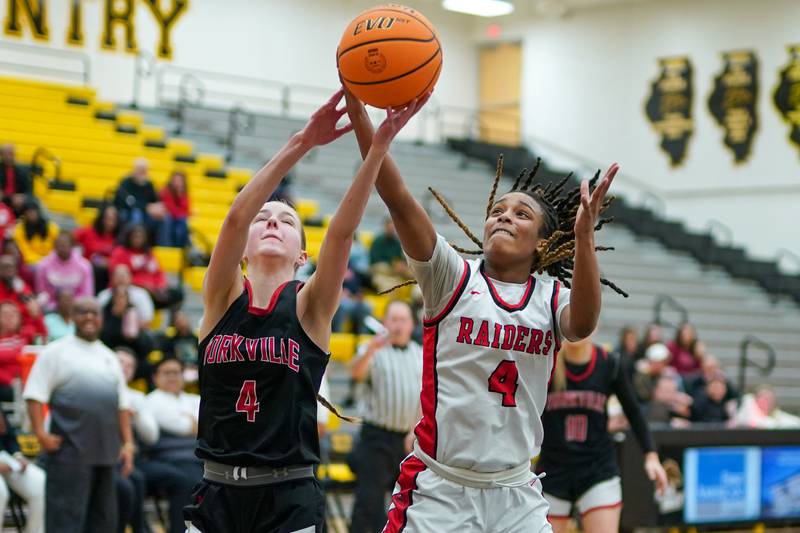 Yorkville's Macie Jones (left), and Bolingbrook's Sydney Dodd (right), fight for a rebound during a Class 4A Metea Valley Regional final basketball game at Metea Valley High School in Aurora on Friday, Feb. 21, 2025.