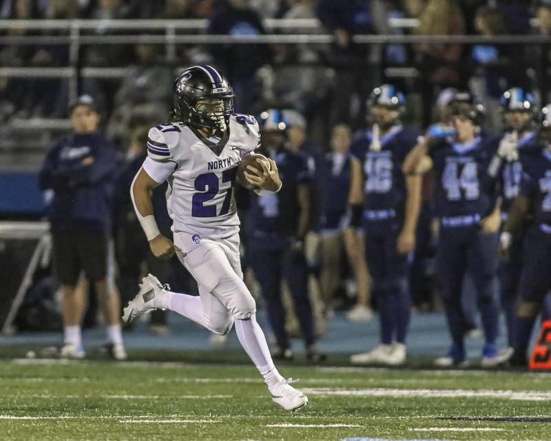 Downers Grove North's Kevin Jay Jr. (27) takes off downfield from the wildcat formation during football game between Downers Grove North at Downers Grove South Friday, Sept 5, 2025  in Downers Grove.