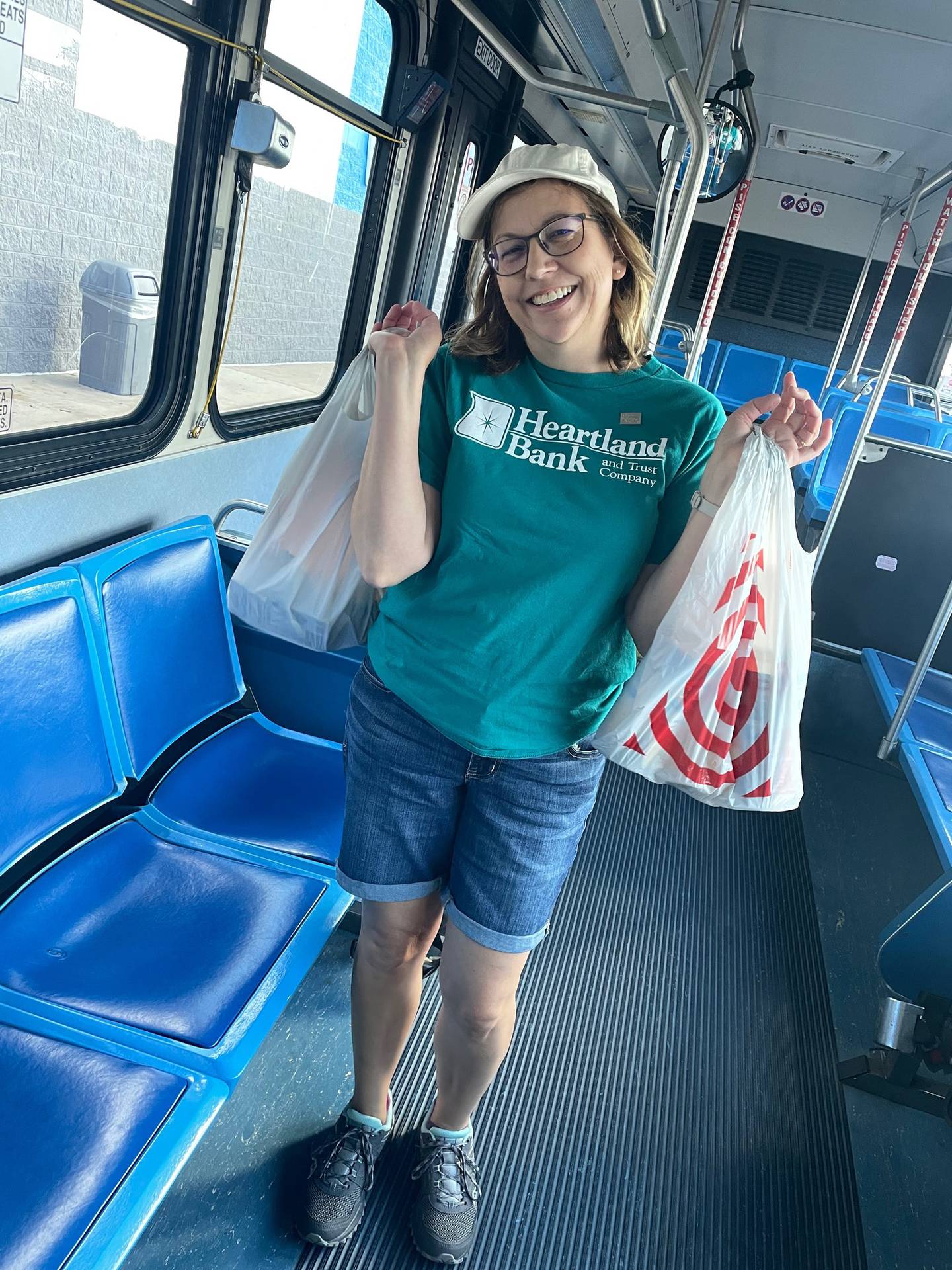 Teresa Jacobson, Kishwaukee United Way Board of Directors member, poses with school supplies on a Transdev bus. Donation collection for a Back-to-School Supply Drive will be located at Walmart parking lot 2300 Sycamore Road, DeKalb. 60115 beginning Aug. 9 through Aug. 11, 2024. The event is cohosted by Kishwaukee United Way and Transdev to benefit DeKalb County school children.
