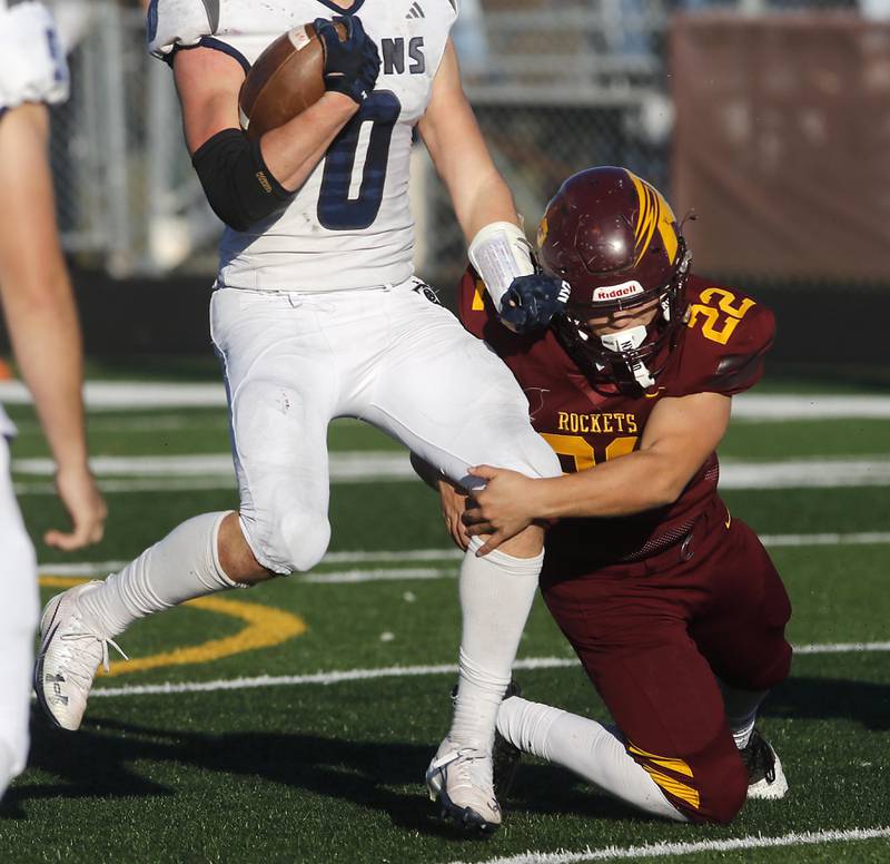 Richmond-Burton's Gavin Busa tries to tackle Monmouth-Roseville's Nick Huston during an IHSA Class 3A quarterfinal playoff football game on Saturday, November 15, 2025, at Richmond-Burton High School, in Richmond.