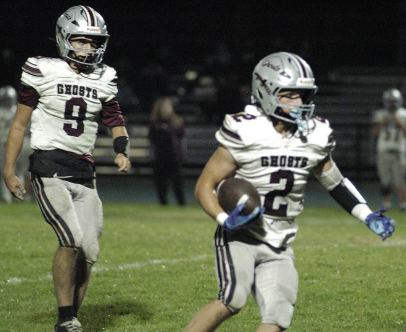 IVC player Sawyer Ellenwood takes a handoff from Keegan Schol. The Grey Ghosts of Illinois Valley Central traveled to Hinders Field in Rock Falls on Friday, October 10, 2025 to take on the Rockets.