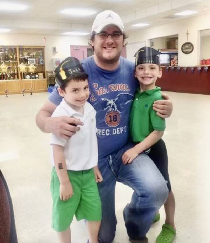 Derek Baird, a classmate of their father, was the Godfather for Hall junior twins Jack (left) and Braden Curran. The boys dedicated Friday's game at Rockridge in memory to their "Uncle Birdy," who passed away Oct. 24 from cancer.