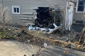 Photos: Stolen car crashes into Crystal Lake home