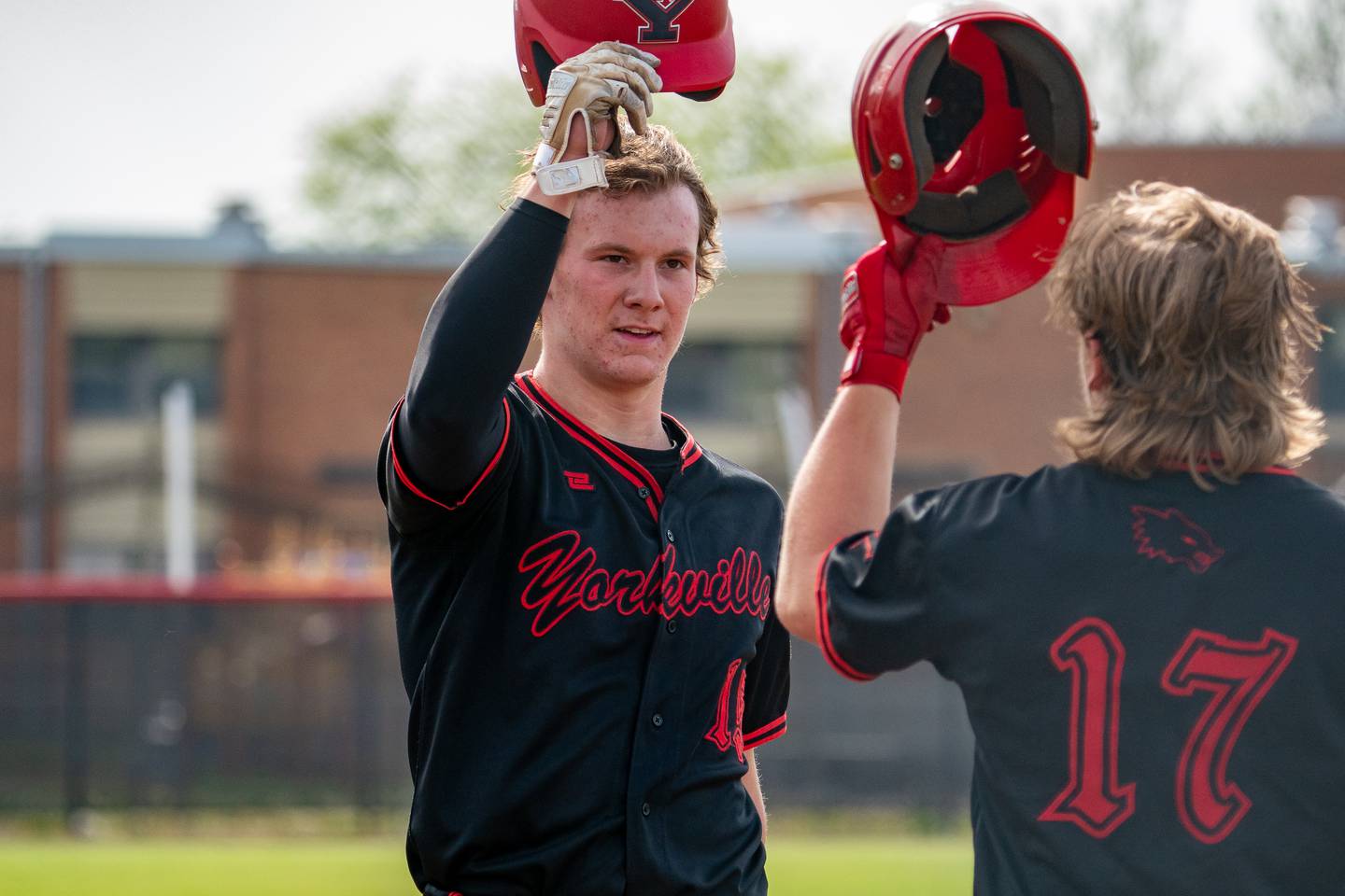 Yorkville's Nate Harris (15) homers against Oswego and is greeted at home plate by Kam Yearsley (17) during a baseball game at Yorkville High School on Monday, May 15, 2023.