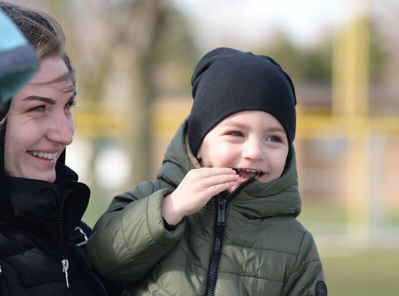 Iryna Puratroneak of Lagrange Park and her son Marks react to seeing the Easter Bunny during the LaGrange Easter Egg Hunt Saturday, March 23, 2024.