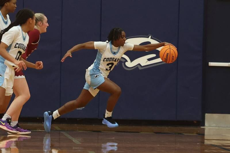 Plainfield South’s Laniya Wills reaches for the rebound against Plainfield North on Thursday, Jan 9, 2025.