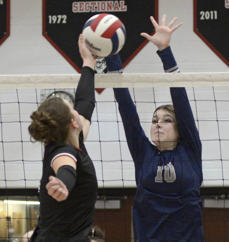 Fieldcrest’s Jersey Modro prepares to block this tip by Woodland’s Grace Longmire in the 1st set of Tuesday’s Sub-Sectional match at Woodland.