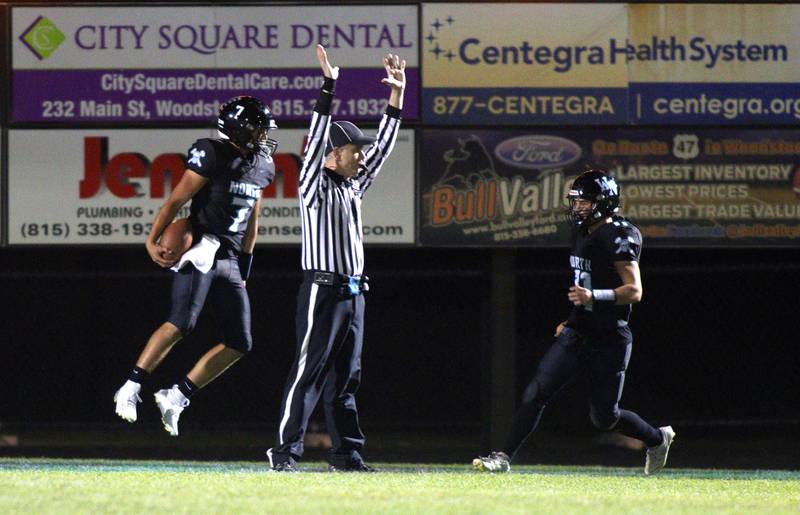 Woodstock North’s Parker Halihan, left, leaps into the end zone with a touchdown against Johnsburg in varsity football on Friday Sept. 27, 2024, at Woodstock North High School in Woodstock.