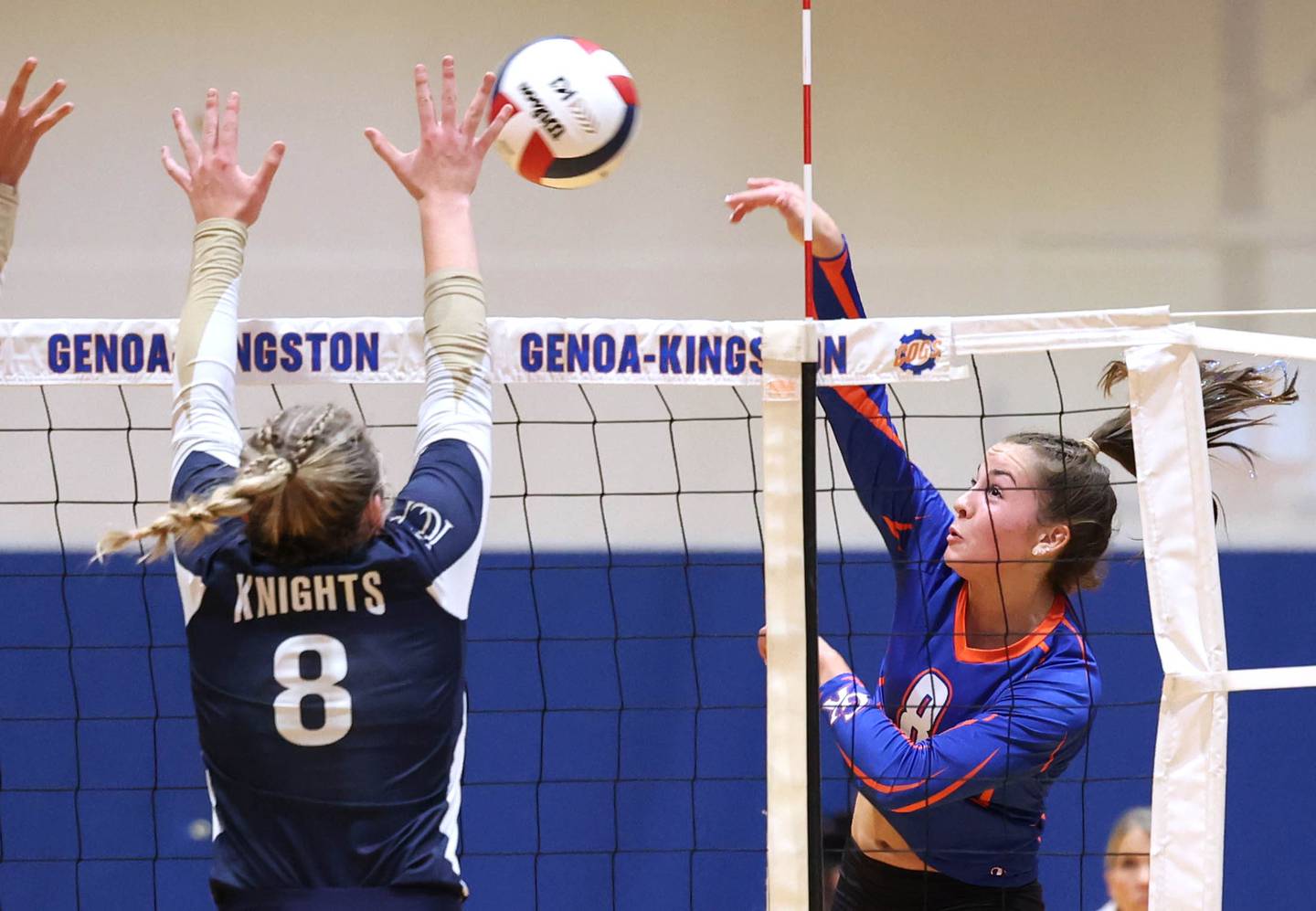 Genoa-Kingston's Alivia Keegan tries to spike the ball by IC Catholic Prep's Lucy Russ during their Class 2A sectional semifinal match Monday, Oct. 30, 2023, at Genoa-Kingston High School.