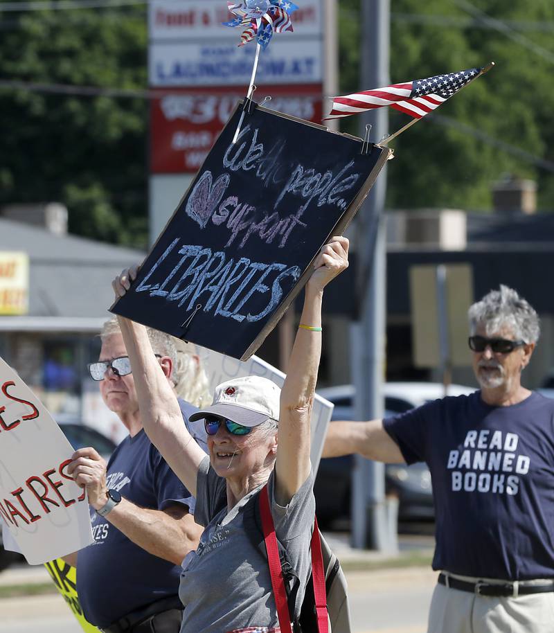 Dorotha King of McHenry protests along Route 31 in front of the McHenry Public Library on Friday, June 20, 2025, during a Save Our Libraries Protest hosted by Indivisible McHenry County to draw attention to cuts to the nation’s libraries by the Trump administration.