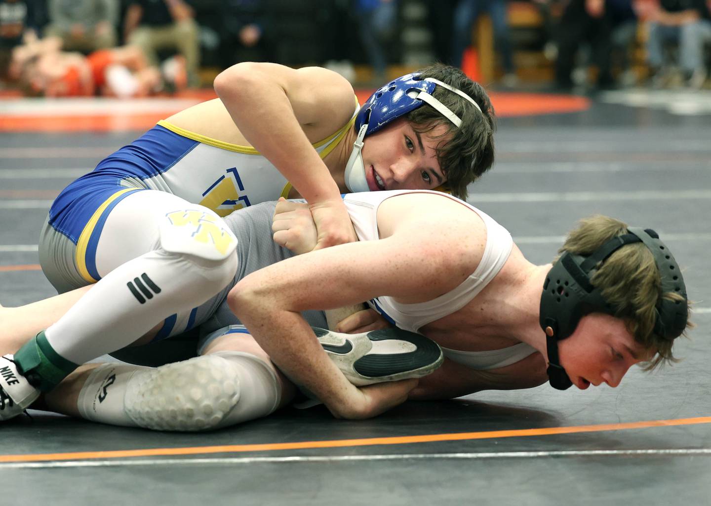 Wheaton North’s Rocco Macellaio works to turn Declan Sons of St. Charles North during their 106 pound championship match Saturday, Feb. 3, 2024 in the Class 3A regional at DeKalb High School. Macellaio won the match with an 8-2 decision.
