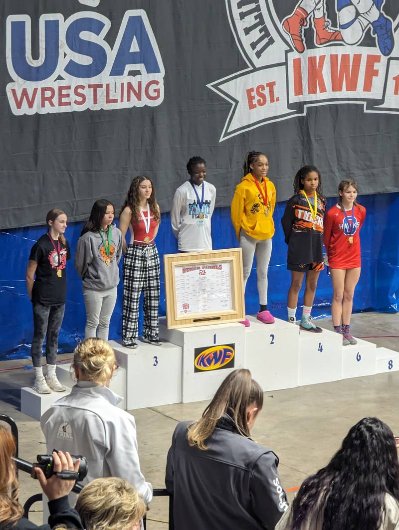 Aplington Middle School eighth grader and Polo resident Zandra Vock (far right) placed sixth at 115 pounds at the first IKWF State Girls Wrestling Tournament at the BMO Center in Rockford. The tournament was held March 9-10.