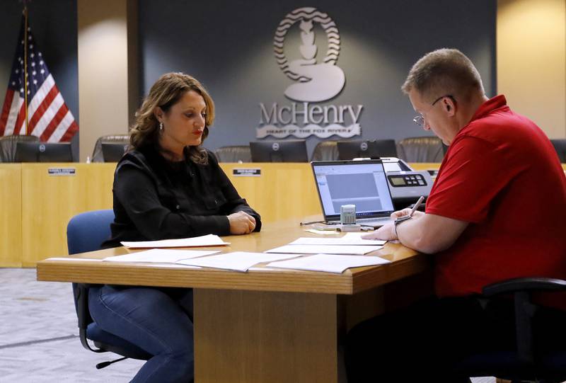 McHenry City Clerk Trisha Ramel files her paperwork Tuesday, Nov. 12, 2024, to run for another term as the city clerk of McHenry with McHenry Deputy Clerk Monte Johnson during first day of filing for the consolidated election on April 1, 2025.