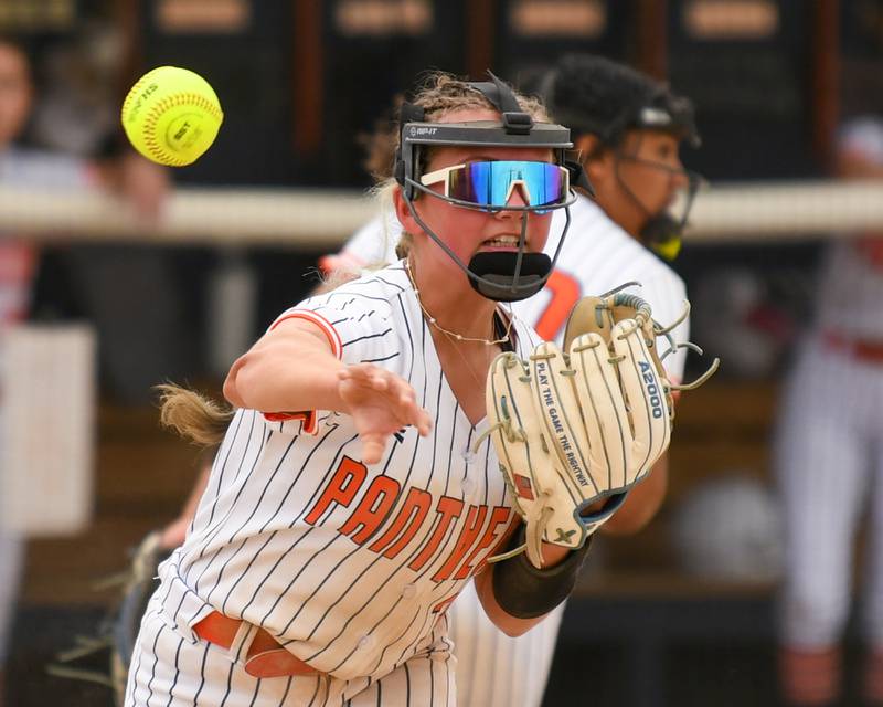 Oswego's Sophie Morland (3) throws the ball to first base in time for an out while taking on Benet Academy during the regional final on Friday May 22, 2026, where the game was held at Oswego High School.