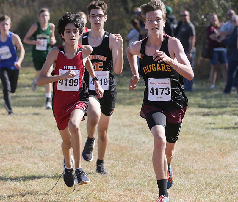 Hall's Joseph Caracheo (left) runs in the Class 1A Regional Cross Country boys race on Saturday, Oct. 22, 2022 at the Seneca FFA Farm in Marseilles.