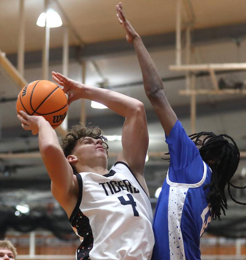 Crystal Lake Central's Bud Shanahan drives to the basket agains tWoodstock's Marc Thomas during a nonconference boys basketball game on Monday Jan. 5,  2026, at Crystal Lake Central School.