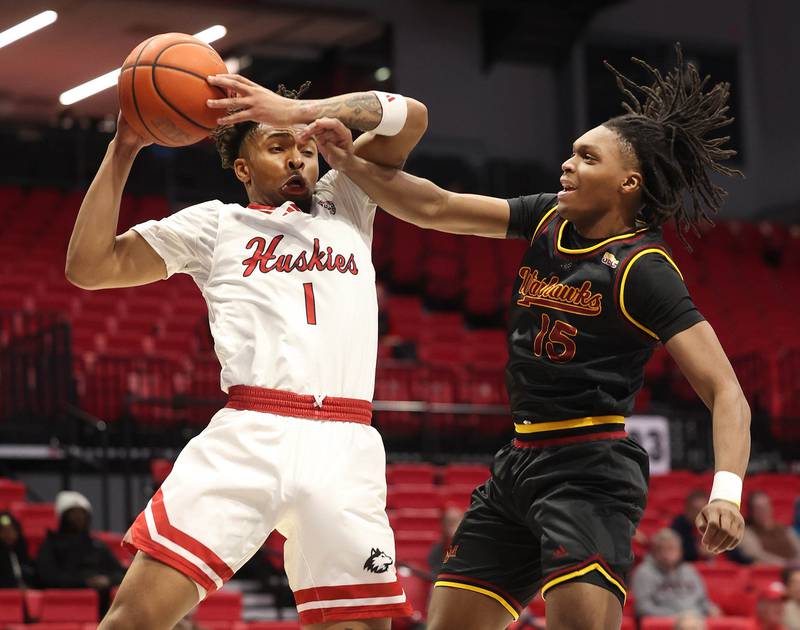 Northern Illinois' guard Makhai Valentine grabs a rebound in front of Louisiana-Monroe's Micah Caster Monday, Nov. 3, 2025, during their game at the Convocation Center at NIU in DeKalb.