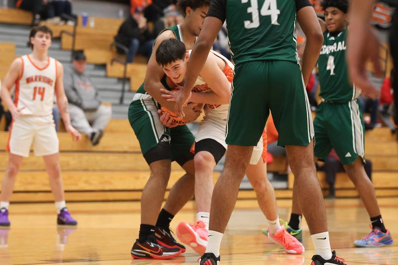 Lincoln-Way West’s Eiden Kubilius battles for the ball against Plainfield Central on Saturday, Jan 3, 2026 in New Lenox.